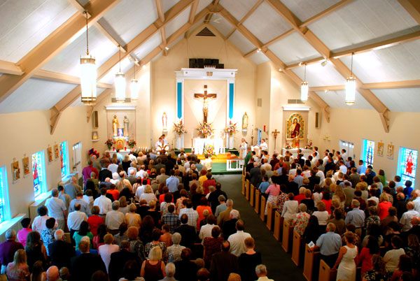 Rev. Michael Voithofer celebrates his first Mass at St. Hugh, his home parish, in 2010. Credit: Margie Rostosky