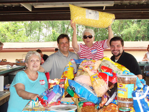 Stocked up for their parish picnic. (L-R) Judy Lee, Rev. Steve Kresak, Rita Woods and seminarian Joe Uzar.