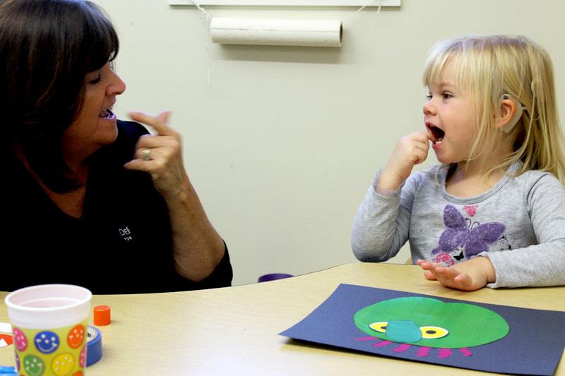 Teaching assistant Maria Supe works with Audrey Craig at the DePaul School for Hearing and Speech. Credit: DePaul School